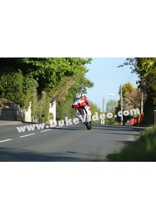 Michael Dunlop wheelies through Ballagarey, TT 2013