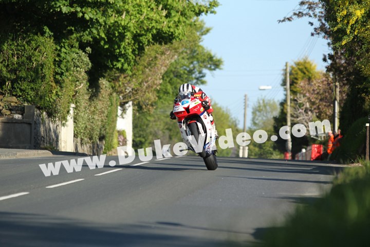 Michael Dunlop wheelies through Ballagarey, TT 2013 - click to enlarge